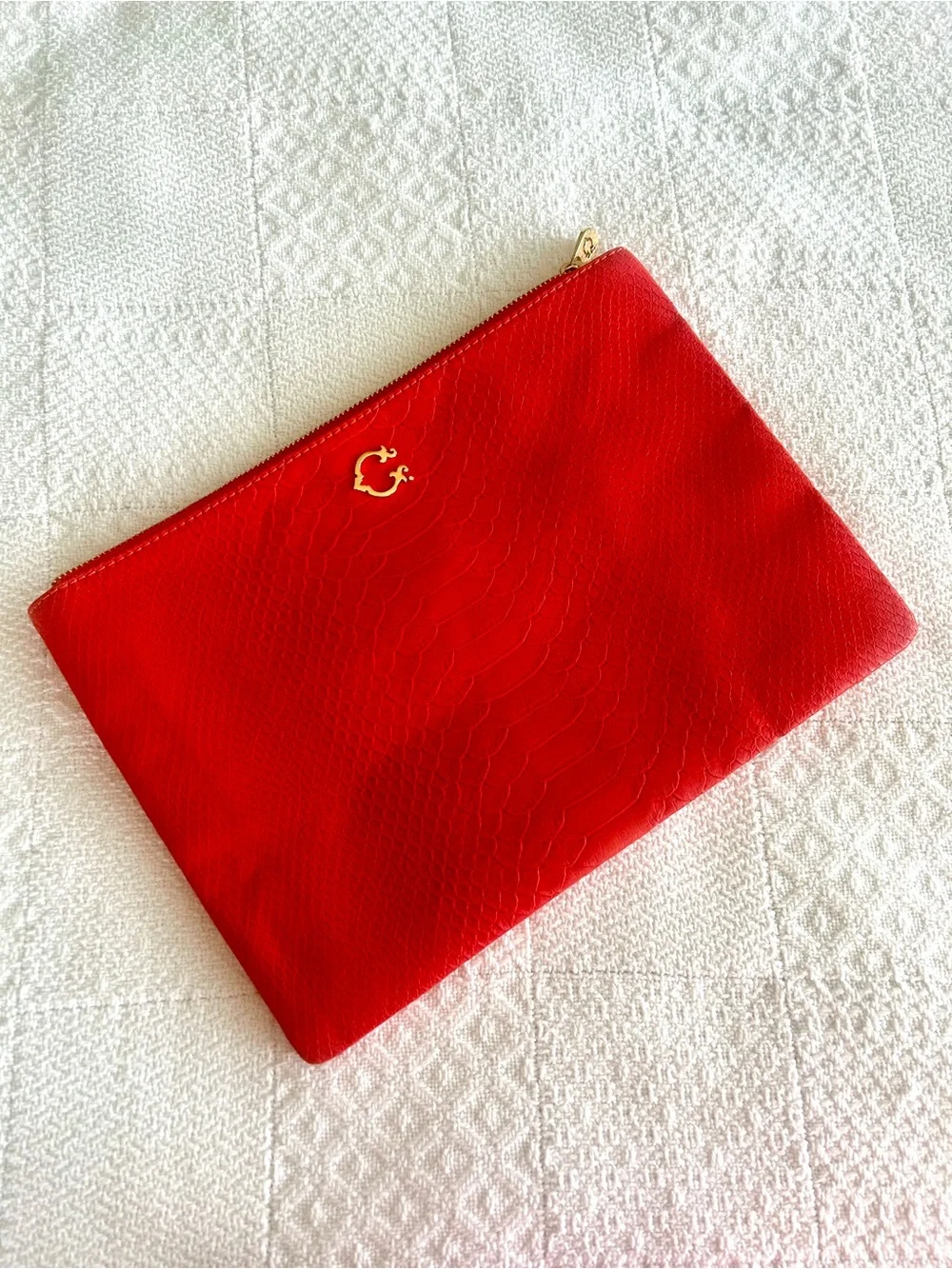 C. Wonder Clutch Orange Red Embossed Print Zip Close with Gold C Emblem